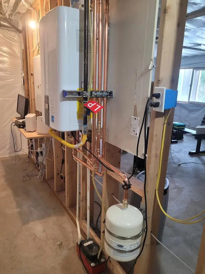 Licensed plumber repairing a kitchen sink in Warren